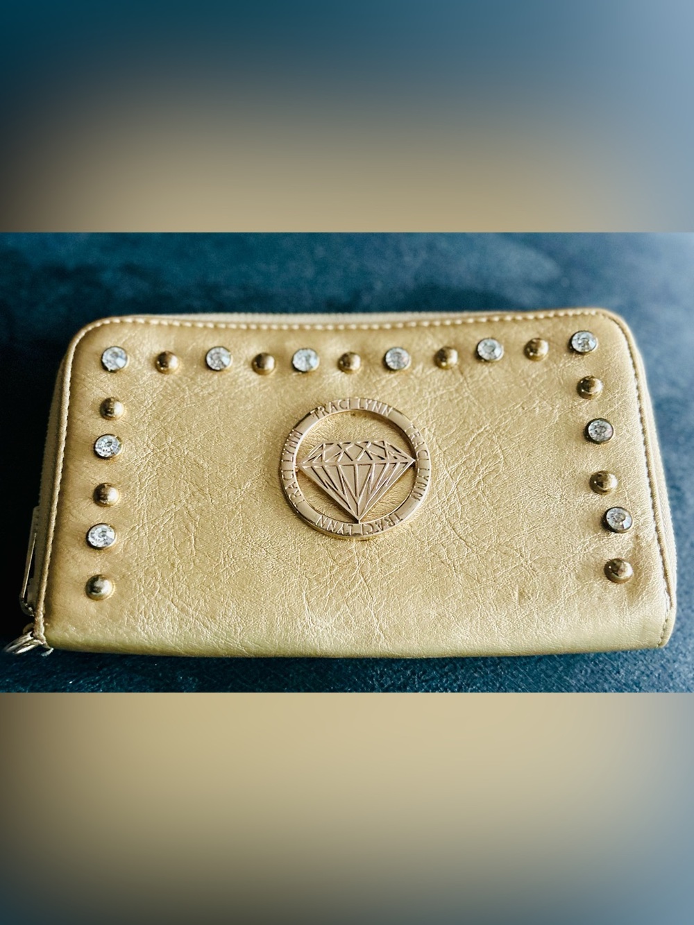 Traci Lynn Shimmering Gold Diamond Emblem Wallet